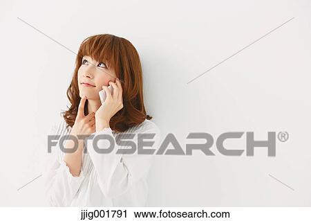Half length portrait of young Japanese woman against white background View Large Photo Image Stock Image - Half length portrait of young Japanese woman against white background. Fotosearch