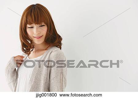 Half length portrait of young Japanese woman against white background View Large Photo Image Stock Image - Half length portrait of young Japanese woman against white background. Fotosearch