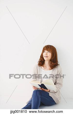 Half length portrait of young Japanese woman against white background View Large Photo Image Stock Image - Half length portrait of young Japanese woman against white background. Fotosearch