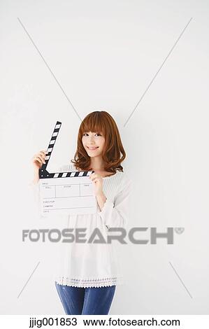 Half length portrait of young Japanese woman against white background View Large Photo Image Stock Image - Half length portrait of young Japanese woman against white background. Fotosearch