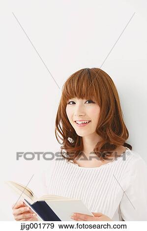 Half length portrait of young Japanese woman against white background View Large Photo Image Stock Photo - Half length portrait of young Japanese woman against white background. Fotosearch