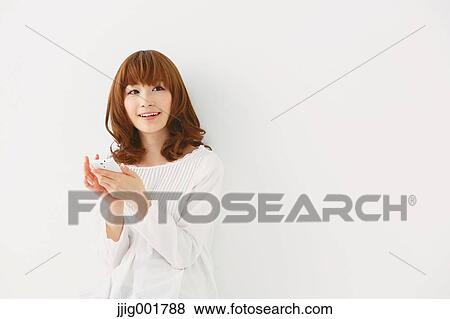 Half length portrait of young Japanese woman against white background View Large Photo Image Stock Photo - Half length portrait of young Japanese woman against white background. Fotosearch