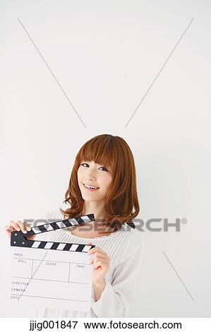 Half length portrait of young Japanese woman against white background View Large Photo Image Stock Photo - Half length portrait of young Japanese woman against white background. Fotosearch