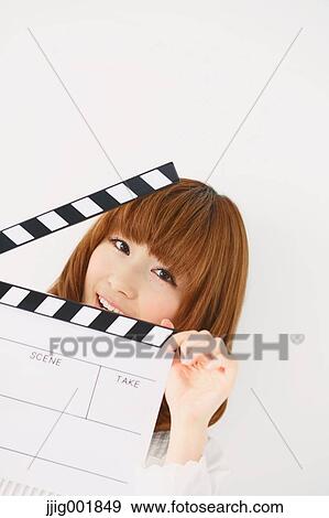 Half length portrait of young Japanese woman against white background View Large Photo Image Stock Photo - Half length portrait of young Japanese woman against white background. Fotosearch