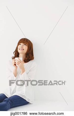 Half length portrait of young Japanese woman against white background View Large Photo Image Stock Photograph - Half length portrait of young Japanese woman against white background. Fotosearch