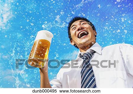 Japanese businessman drinking draft beer View Large Photo Image Stock Photography - Japanese businessman drinking draft beer. Fotosearch