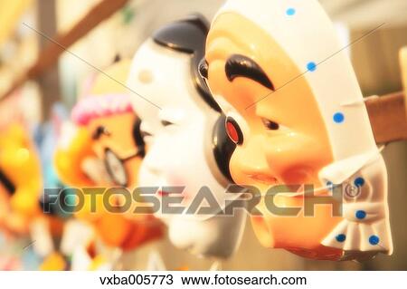Stock Image - Japanese masks at Matsuri festival. Fotosearch