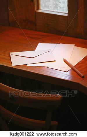 Stock Image - Letters And Pencil On Wooden Table. Fotosearch