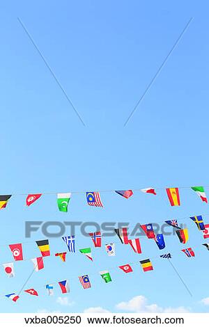 Stock Image - National Flags And Blue Sky. Fotosearch