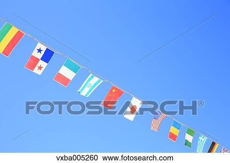 Stock Image - National Flags And Blue Sky. Fotosearch
