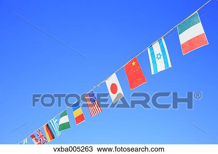 Stock Image - National Flags And Blue Sky. Fotosearch