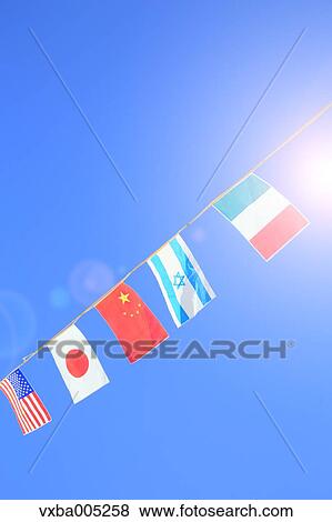Stock Photo - National Flags And Blue Sky. Fotosearch