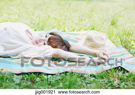 Portrait of young Japanese woman in a park View Large Photo Image Stock Image - Portrait of young Japanese woman in a park. Fotosearch