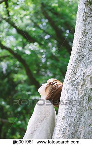 Portrait of young Japanese woman in a park View Large Photo Image Stock Image - Portrait of young Japanese woman in a park. Fotosearch