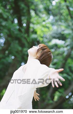 Portrait of young Japanese woman in a park View Large Photo Image Stock Image - Portrait of young Japanese woman in a park. Fotosearch
