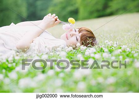 Portrait of young Japanese woman in a park View Large Photo Image Stock Image - Portrait of young Japanese woman in a park. Fotosearch