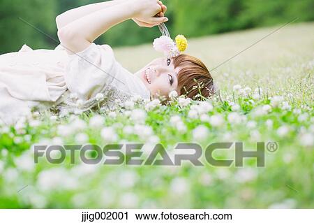 Portrait of young Japanese woman in a park View Large Photo Image Stock Image - Portrait of young Japanese woman in a park. Fotosearch