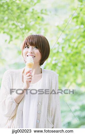 Portrait of young Japanese woman in a park View Large Photo Image Stock Image - Portrait of young Japanese woman in a park. Fotosearch