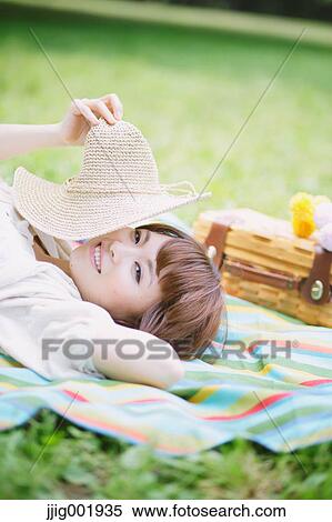 Portrait of young Japanese woman in a park View Large Photo Image Stock Photography - Portrait of young Japanese woman in a park. Fotosearch