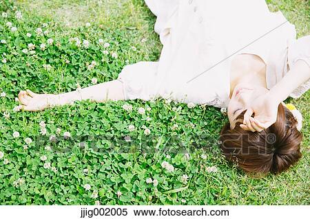Portrait of young Japanese woman in a park View Large Photo Image Stock Photography - Portrait of young Japanese woman in a park. Fotosearch