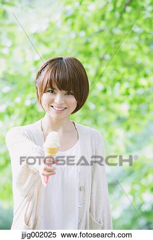 Portrait of young Japanese woman in a park View Large Photo Image Stock Photography - Portrait of young Japanese woman in a park. Fotosearch
