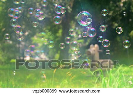 Soap Bubbles In A Park View Large Photo Image Stock Photo - Soap Bubbles In A Park. Fotosearch