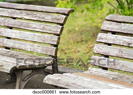 Wooden benches in a park View Large Photo Image Stock Image - Wooden benches in a park. Fotosearch