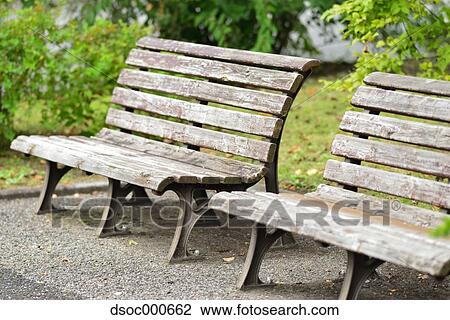 Wooden benches in a park View Large Photo Image Stock Image - Wooden benches in a park. Fotosearch