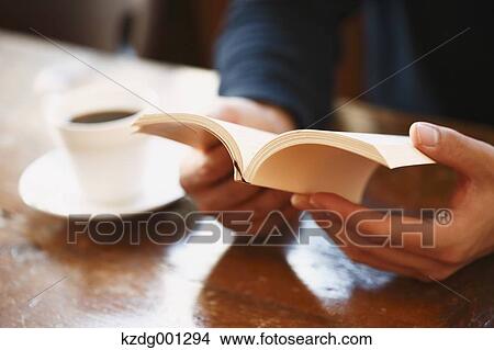 Young Japanese Man Reading A Book In A Cafe View Large Photo Image Picture - Young Japanese Man Reading A Book In A Cafe. Fotosearch