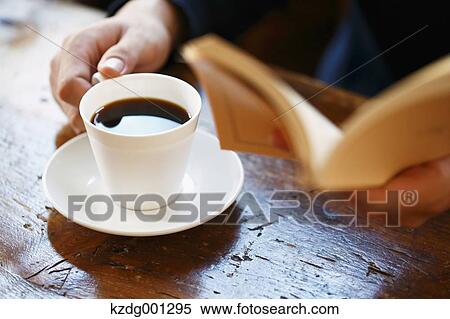 Young Japanese Man Reading A Book In A Cafe View Large Photo Image Stock Photography - Young Japanese Man Reading A Book In A Cafe. Fotosearch