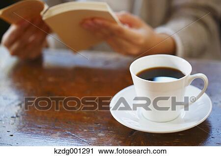 Young Japanese Woman Reading A Book In A Cafe View Large Photo Image Stock Image - Young Japanese Woman Reading A Book In A Cafe. Fotosearch
