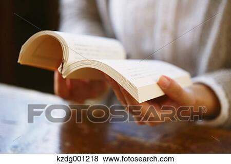 Young Japanese Woman Reading A Book In A Cafe View Large Photo Image Stock Photo - Young Japanese Woman Reading A Book In A Cafe. Fotosearch