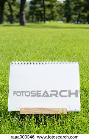 Empty sketchbook on grassland View Large Photo Image Stock Photograph - Empty sketchbook on grassland. Fotosearch