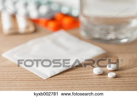 Pills on wooden table View Large Photo Image Stock Image - Pills on wooden table. Fotosearch