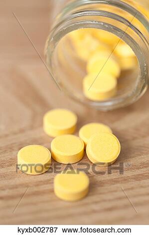 Pills on wooden table View Large Photo Image Stock Photo - Pills on wooden table. Fotosearch