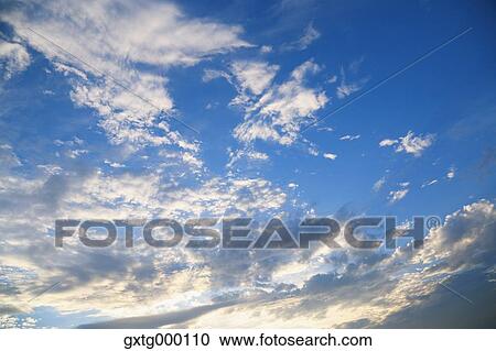 Stock Image - Blue sky with clouds. Fotosearch