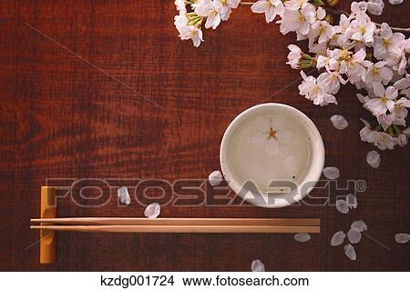 Chopsticks sake and cherry blossoms View Large Photo Image Picture - Chopsticks sake and cherry blossoms. Fotosearch