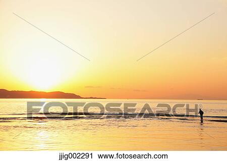 "Fisherman at sea at sunset, Chiba Prefecture, Japan" View Large Photo Image Stock Image - "Fisherman at sea at sunset, Chiba Prefecture, Japan". Fotosearch