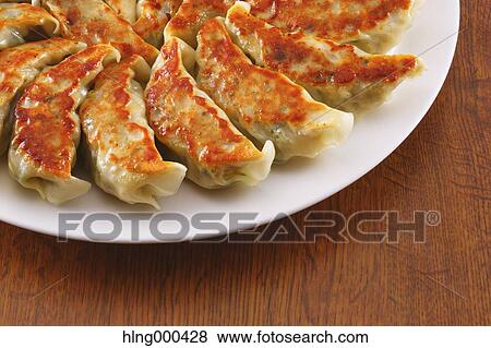 Gyoza dumplings View Large Photo Image Stock Photo - Gyoza dumplings. Fotosearch