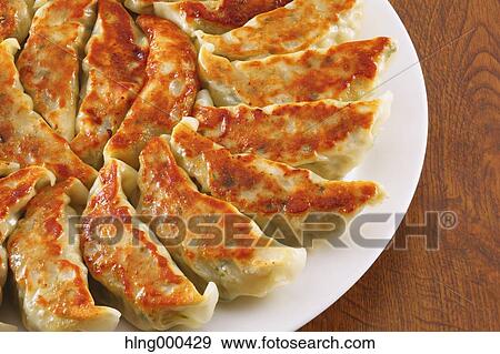 Gyoza dumplings View Large Photo Image Stock Photo - Gyoza dumplings. Fotosearch