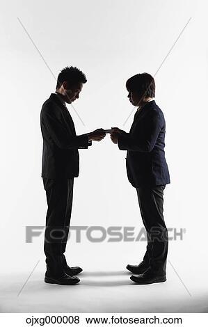 Japanese business people exchanging business cards View Large Photo Image Stock Photo - Japanese business people exchanging business cards. Fotosearch