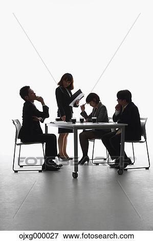 Japanese business people having a meeting View Large Photo Image Stock Photo - Japanese business people having a meeting. Fotosearch