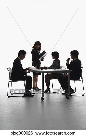 Japanese business people having a meeting View Large Photo Image Stock Photograph - Japanese business people having a meeting. Fotosearch