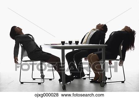 Stock Photo - Japanese business people tired after a meeting. Fotosearch