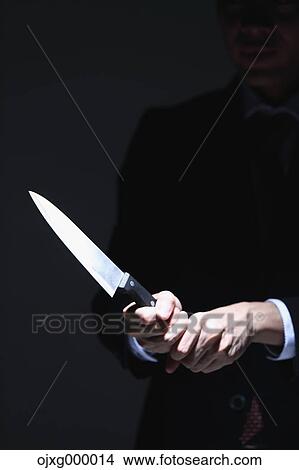 Japanese businessman holding kitchen knife View Large Photo Image Picture - Japanese businessman holding kitchen knife. Fotosearch