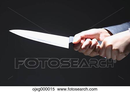 Stock Photography - Japanese businessman holding kitchen knife. Fotosearch