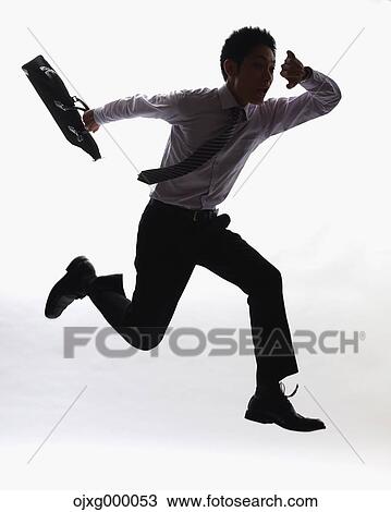 Stock Image - Japanese businessman sprinting. Fotosearch