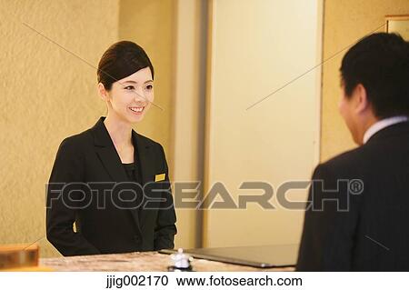 Japanese female hotel concierge dealing with a customer View Large Photo Image Stock Image - Japanese female hotel concierge dealing with a customer. Fotosearch