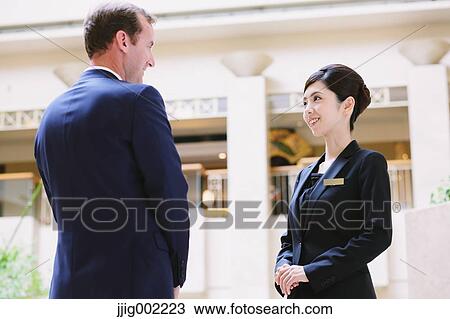 Japanese female hotel concierge dealing with a customer View Large Photo Image Stock Image - Japanese female hotel concierge dealing with a customer. Fotosearch