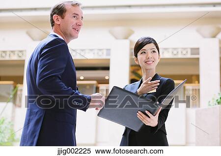 Japanese female hotel concierge dealing with a customer View Large Photo Image Stock Photography - Japanese female hotel concierge dealing with a customer. Fotosearch